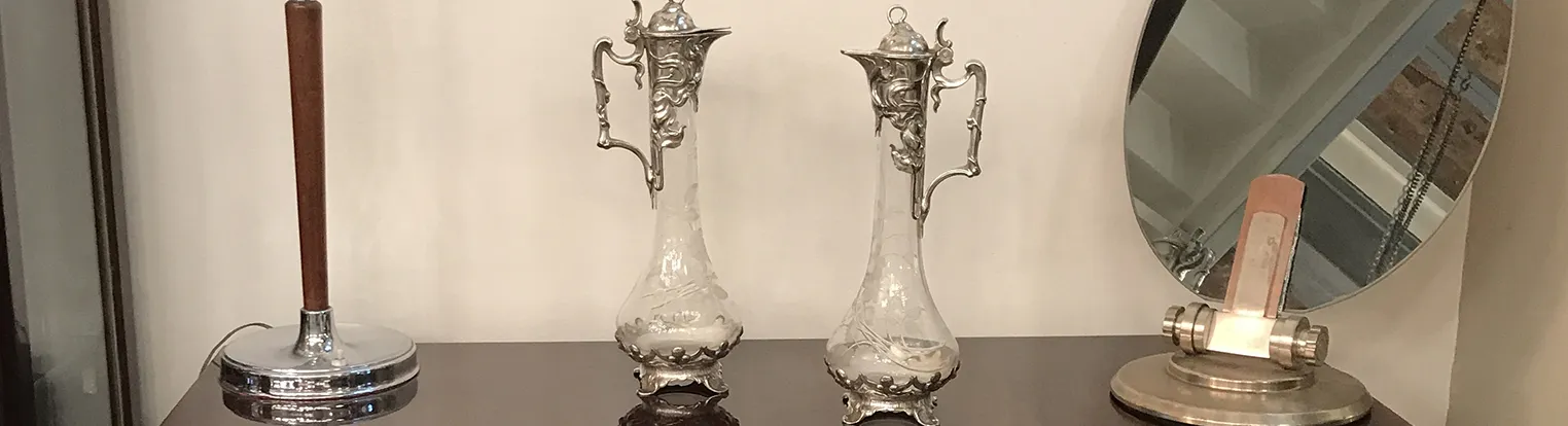 Set of antique glass jugs with intricate designs, Art Nouveau style.