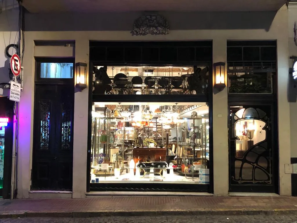 front of an antique store with lighting