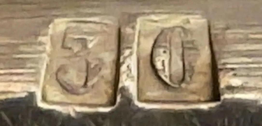 antique detail with serial number 30 on wood