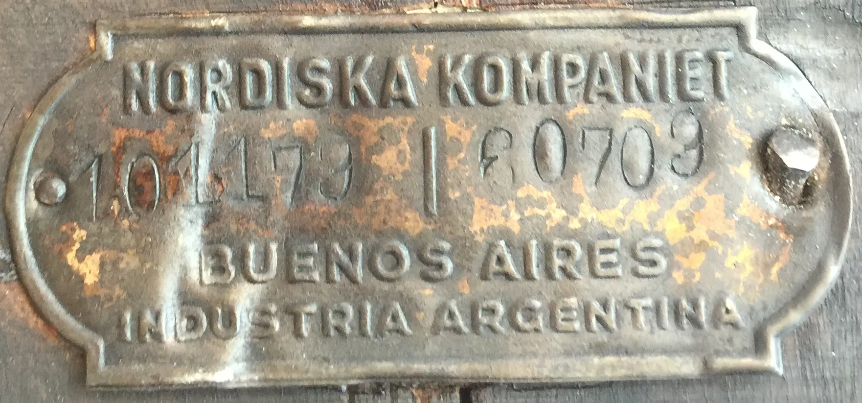 Engraved plate of an antique Nordiska Kompaniet with the serial number clear.