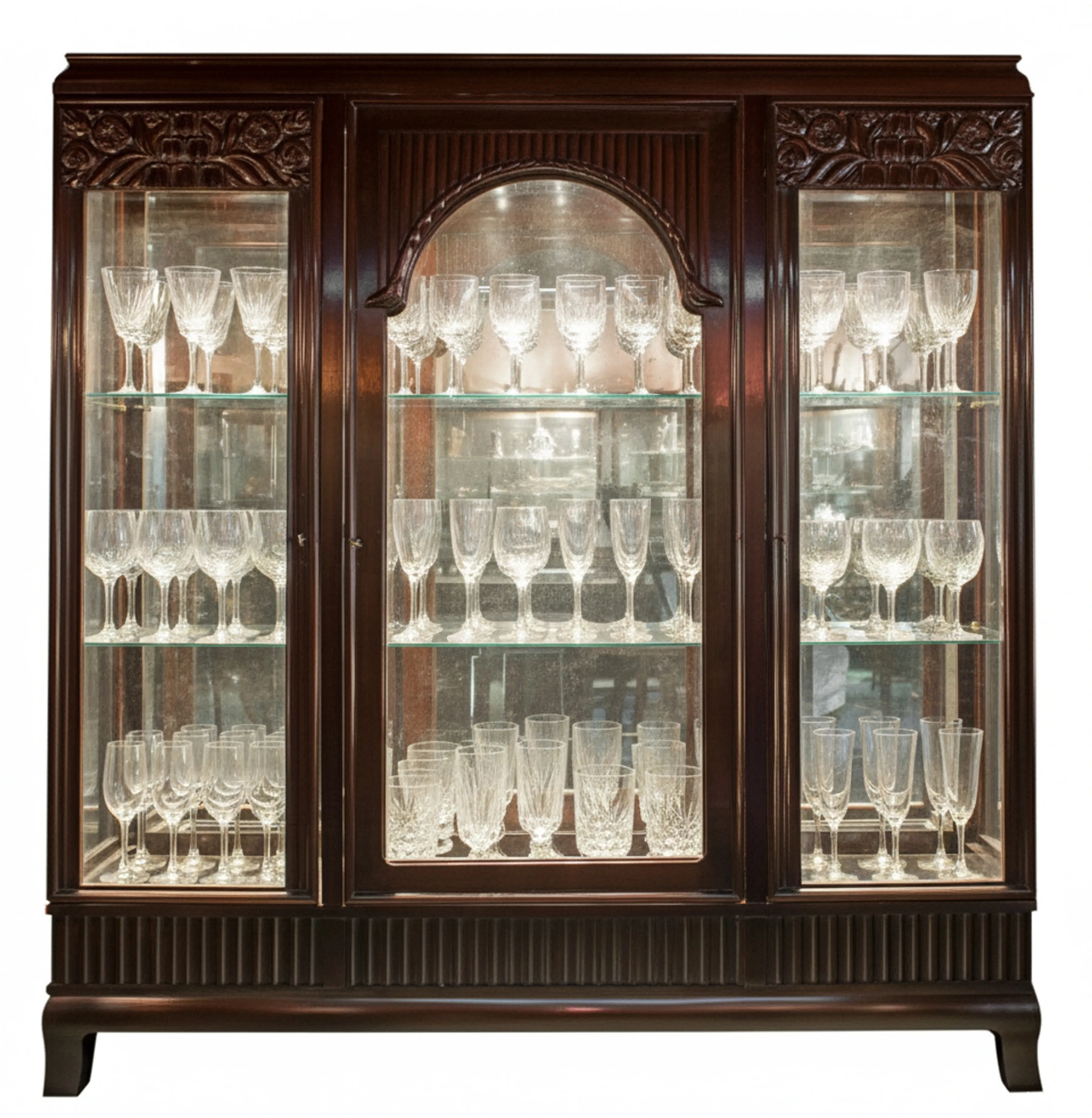 antique display cabinet with compartments for glasses and decorations in a bright setting