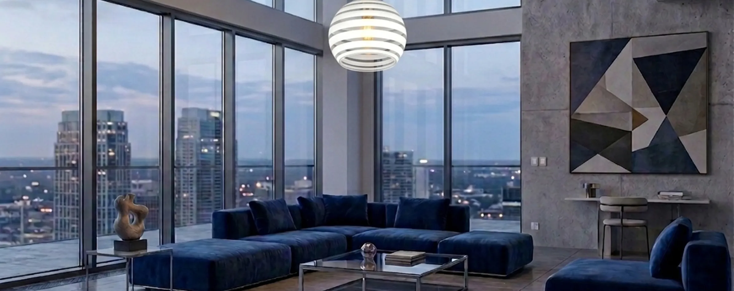 Antique hanging lamp by Paolo Venini providing soft light in a modern setting with blue sofas