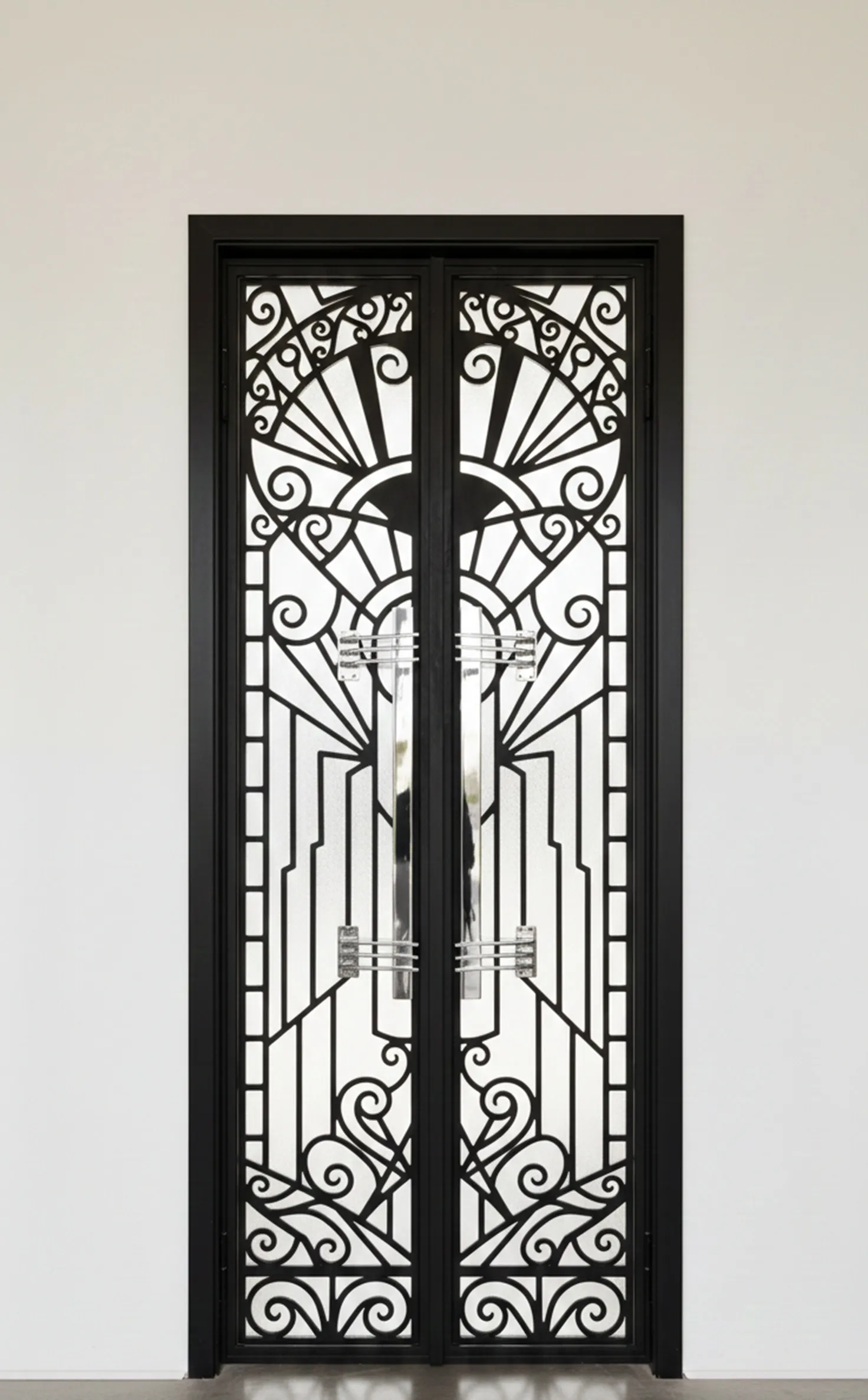 Elegant antique door handles with a decorative design.