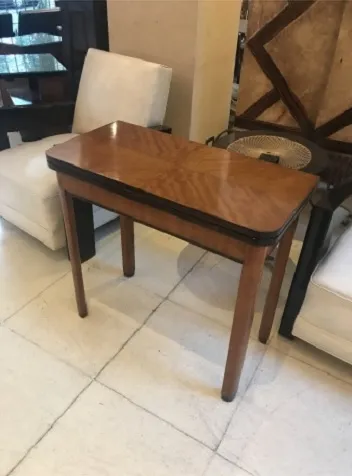 antique console in a classic setting with chairs