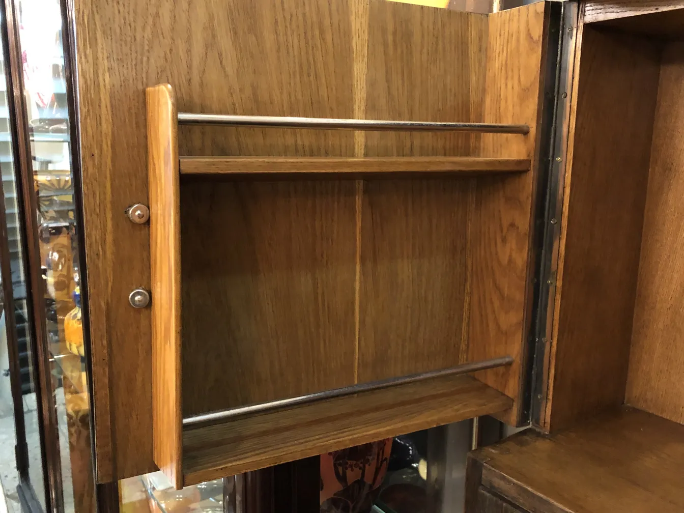 Antique bar furniture with wooden shelves inside.