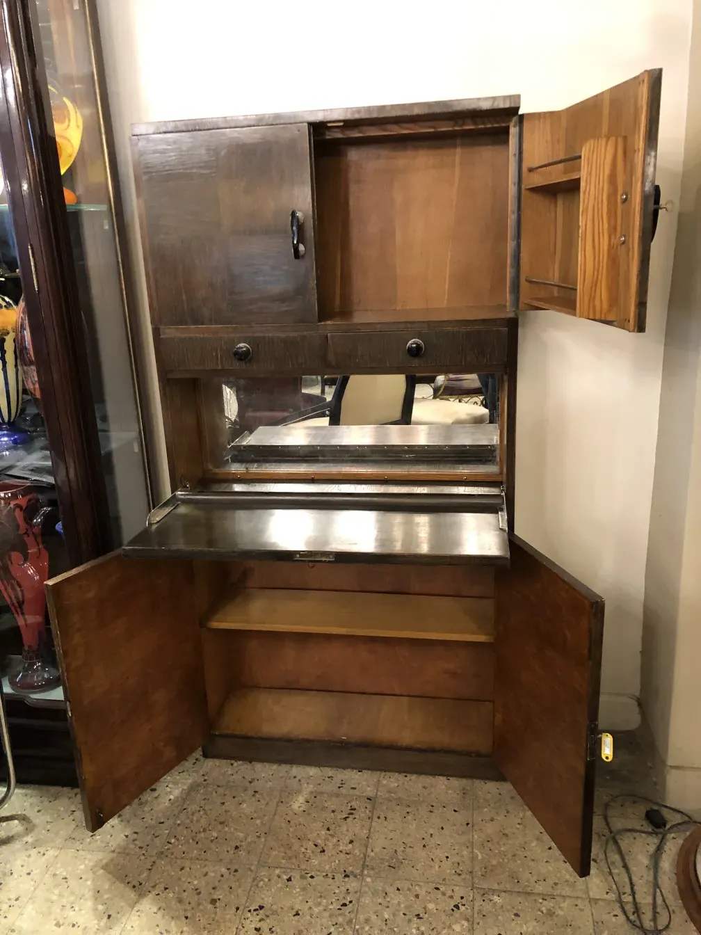 Antique bar with a mirror, perfect for storage