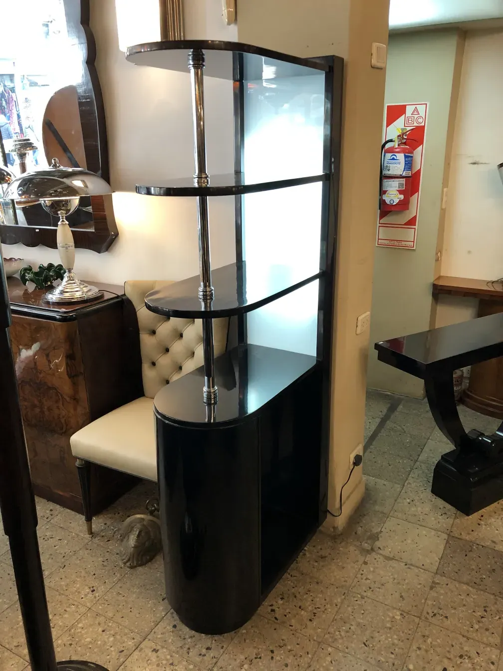 Elegant antique bar furniture with shelves and a sleek design.