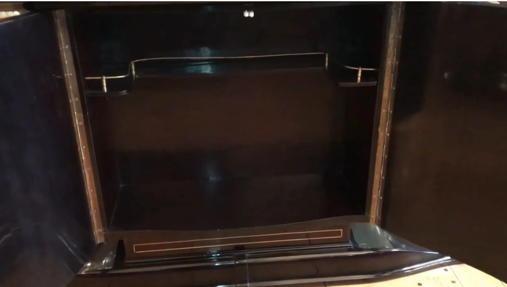interior view of two antique consoles with open doors