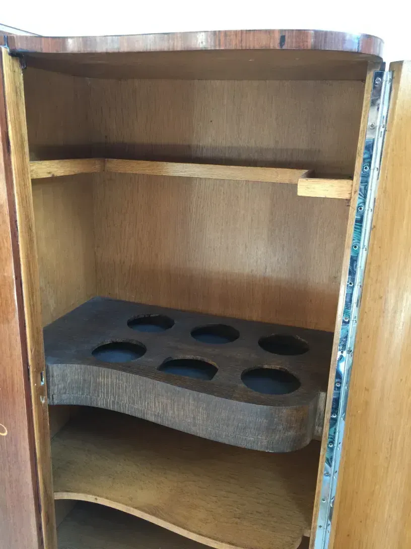 Interior view of an antique bookcase with shelves and dividers