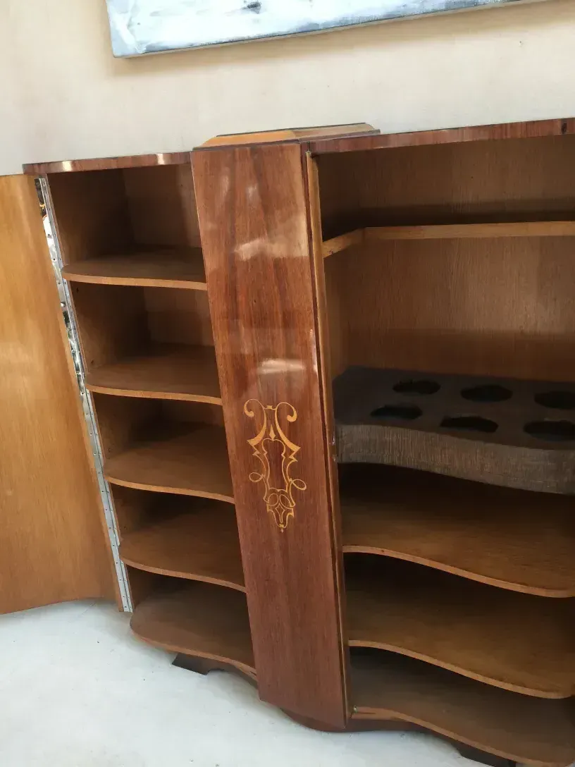 Antique bookcase with compartments and intricate details