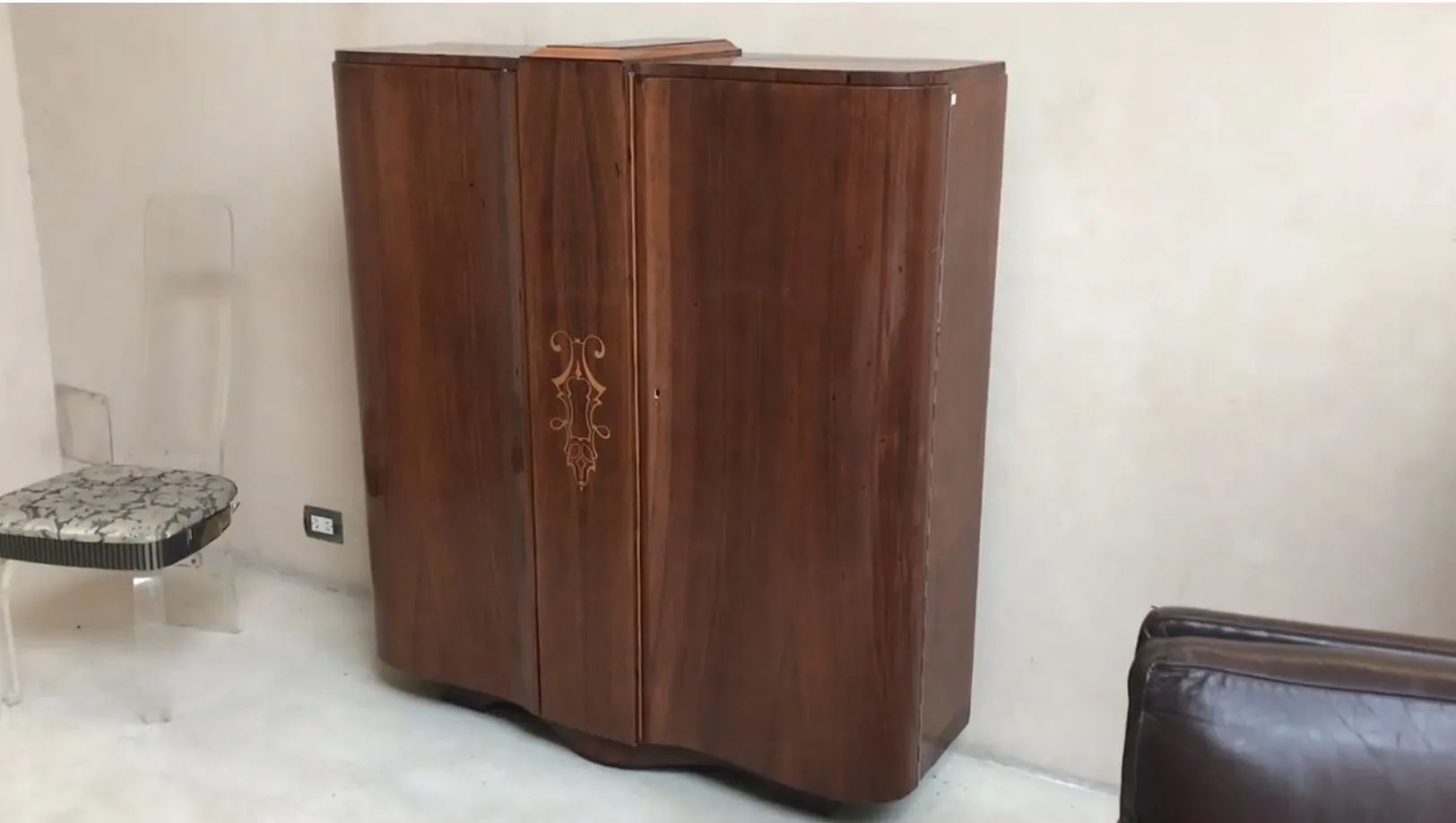 antique bookcase with sophisticated finish and decorative details, modern surroundings
