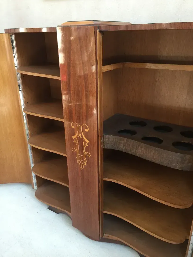 antique bookcase with carvings and compartments