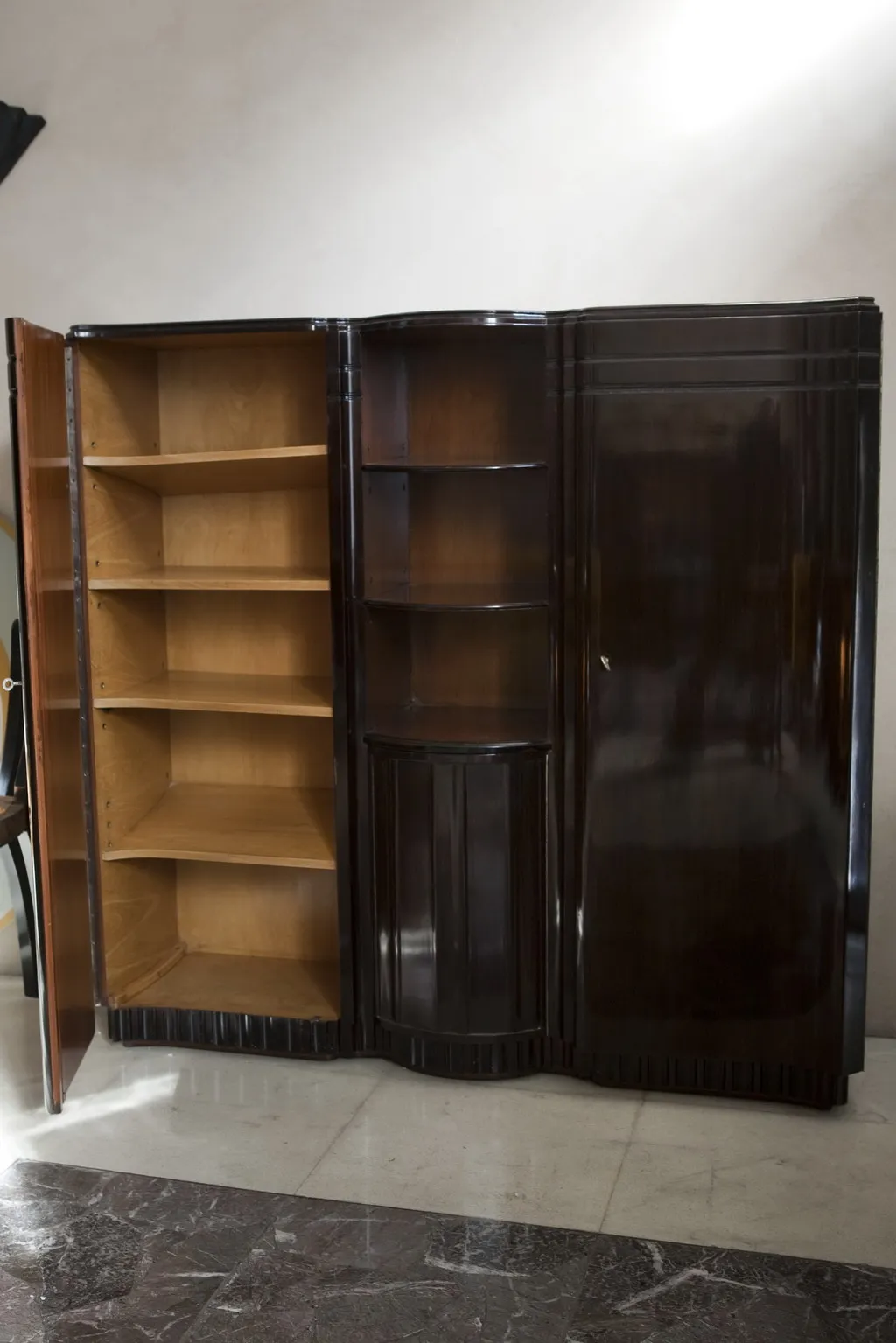 Antique bookcase with open shelves and classic design.