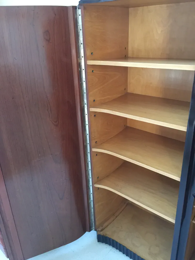Antique shelf featuring several divisions and striking back