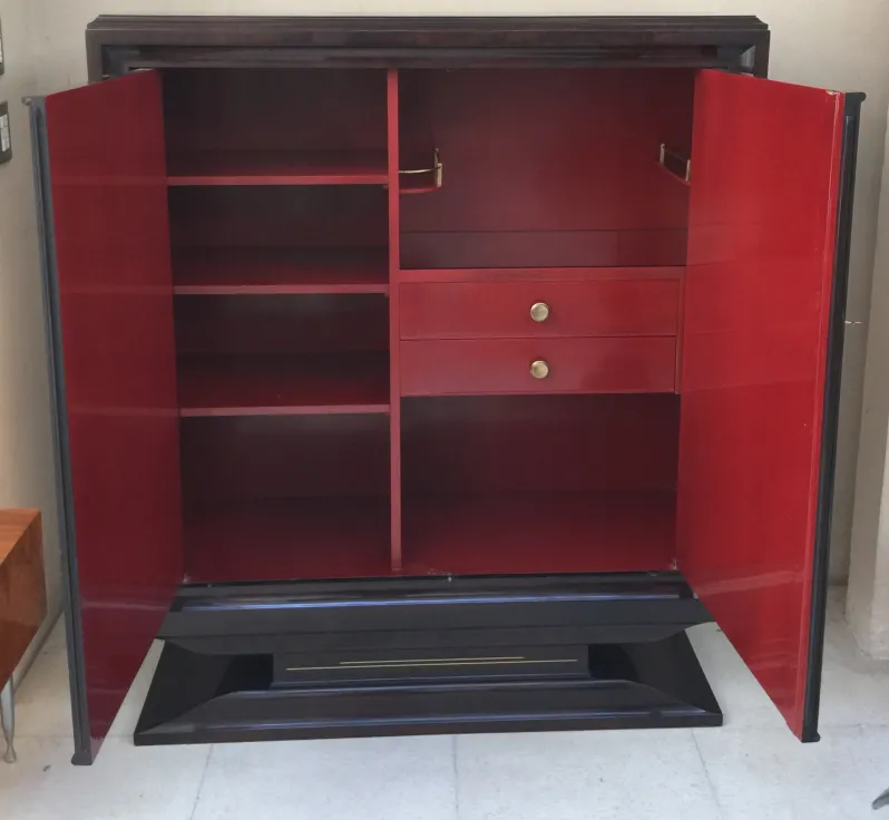 antique bookcase featuring red doors and elegant design