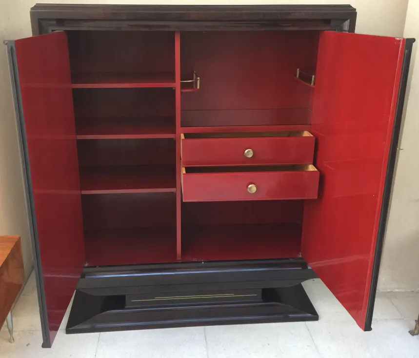antique bookcase with red doors and spacious shelves