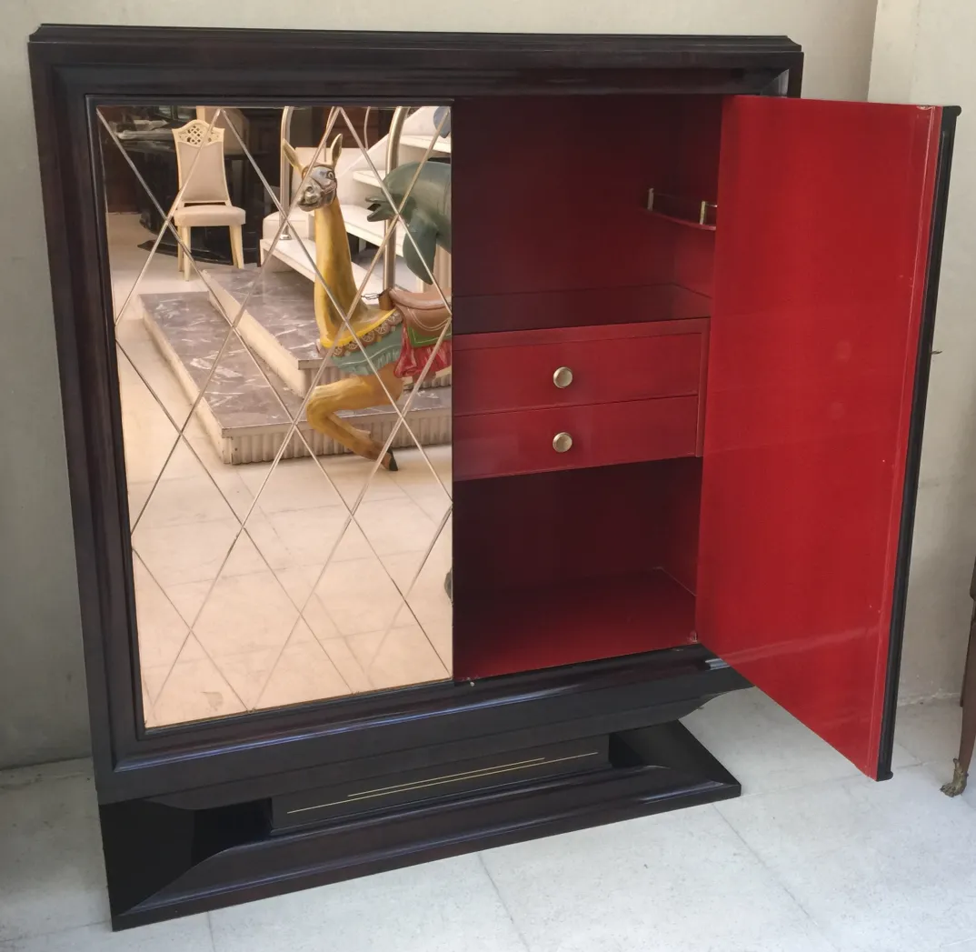 antique bookcase with mirrors and red interior space