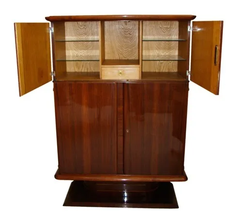 Antique bookcase featuring glass shelves, elegant wooden finish.