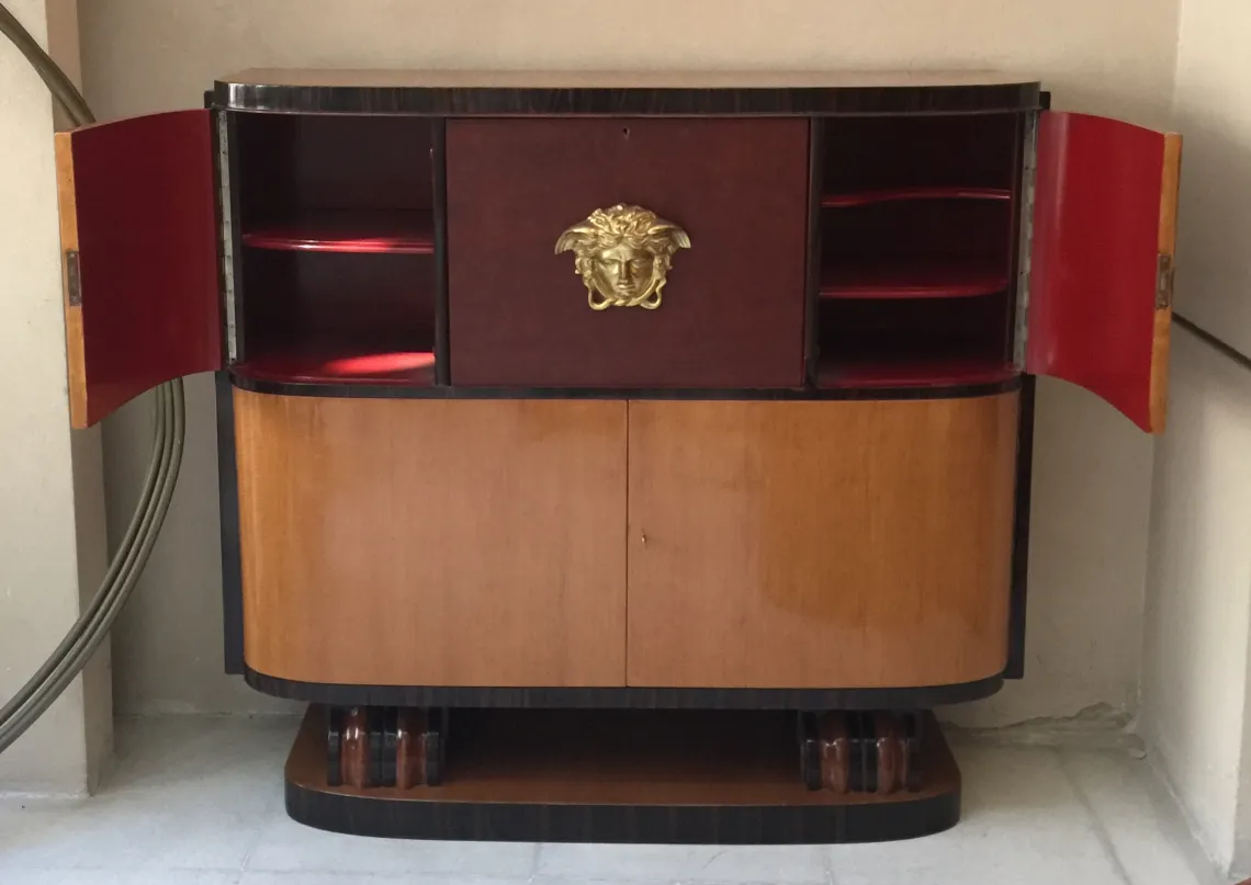 antique bookcase with red and gold fronts, classic atmosphere