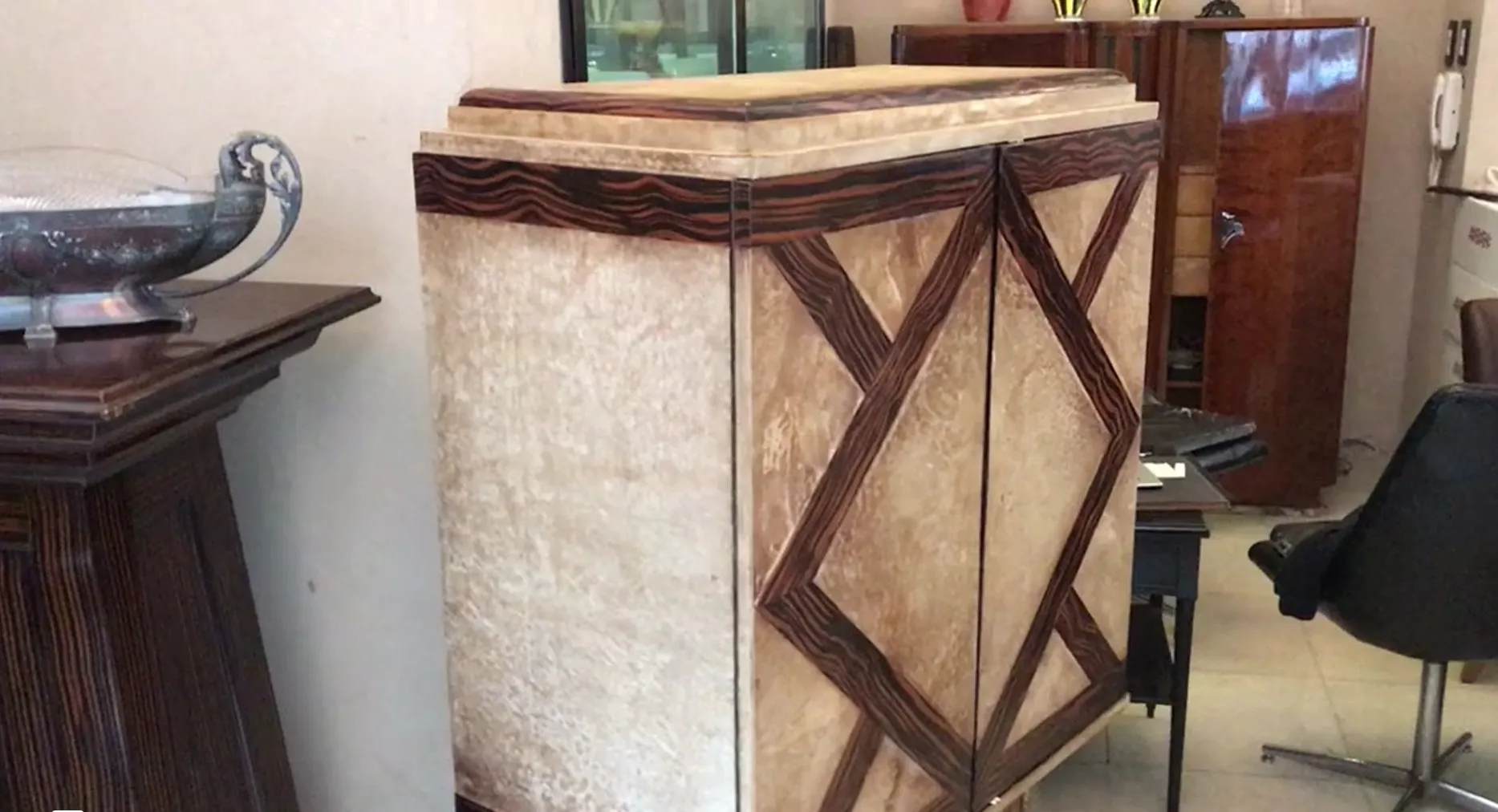 antique bookcase with geometric design, elegant setting