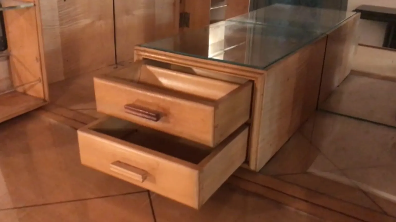 Antique bar furniture with two drawers in a cozy setting.