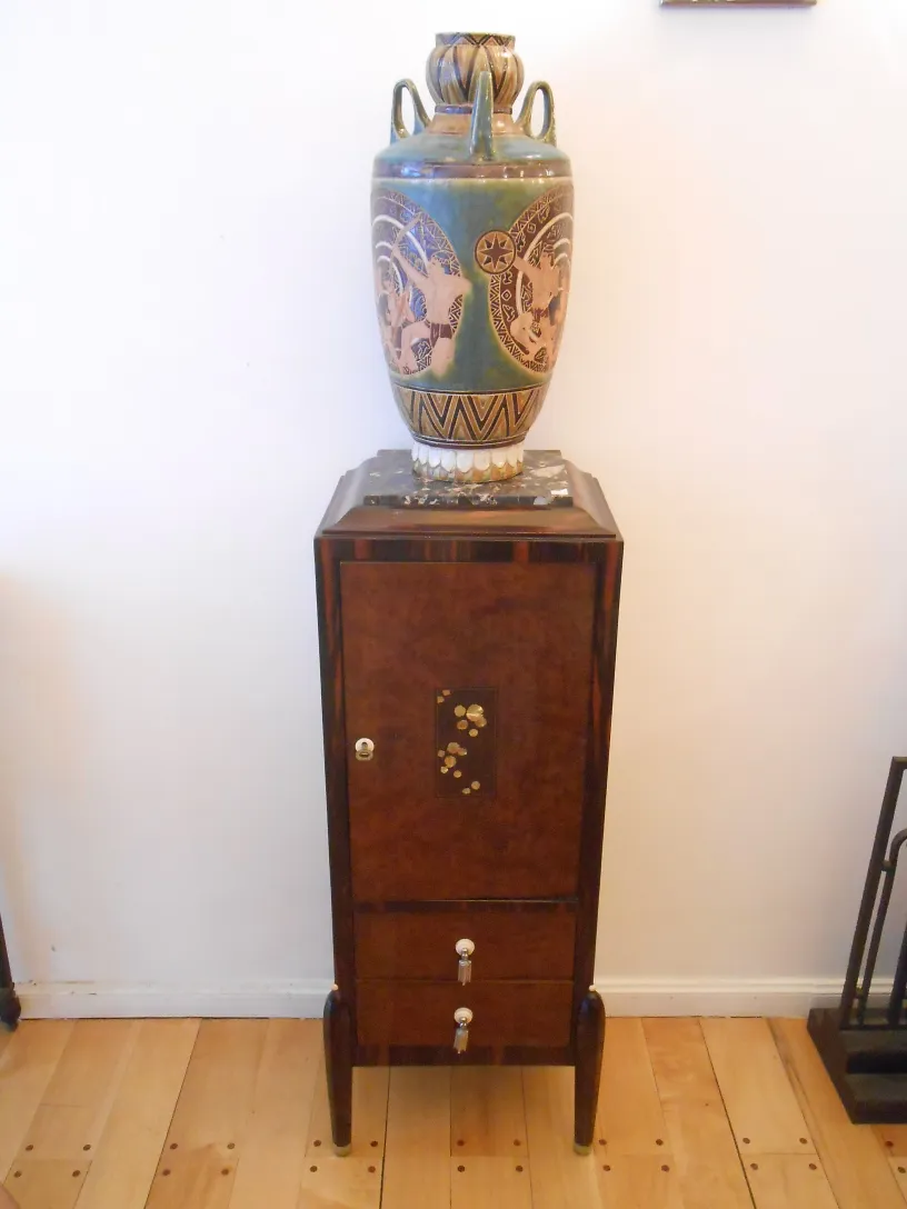 antique column with a decorative vase on top
