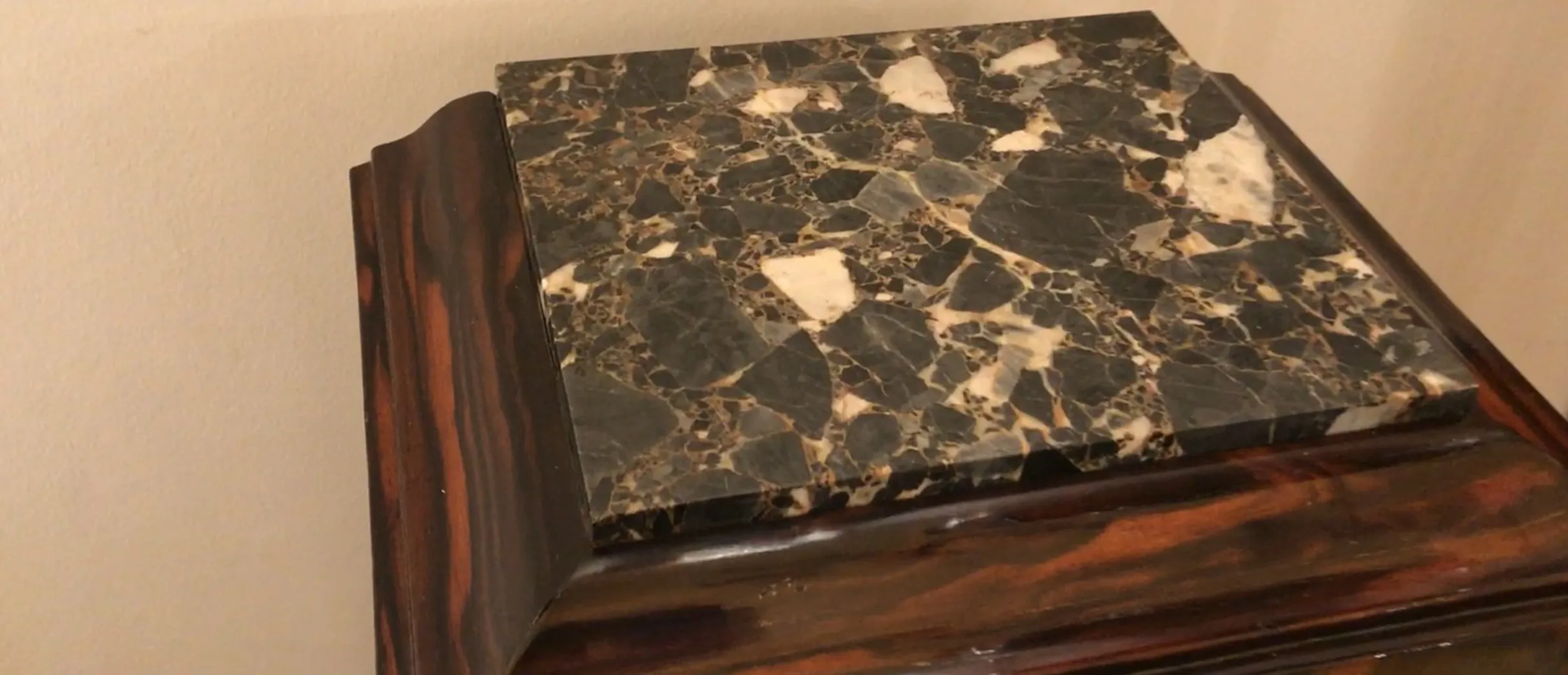 antique column with decorative base and marble