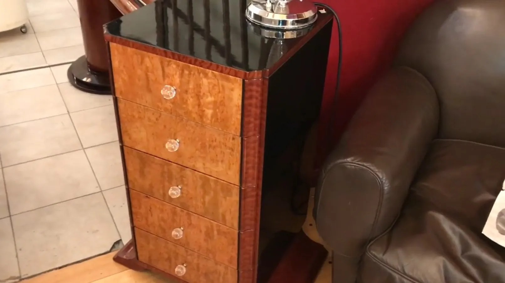 Antique cabinet with four drawers, clear details and elegant style.