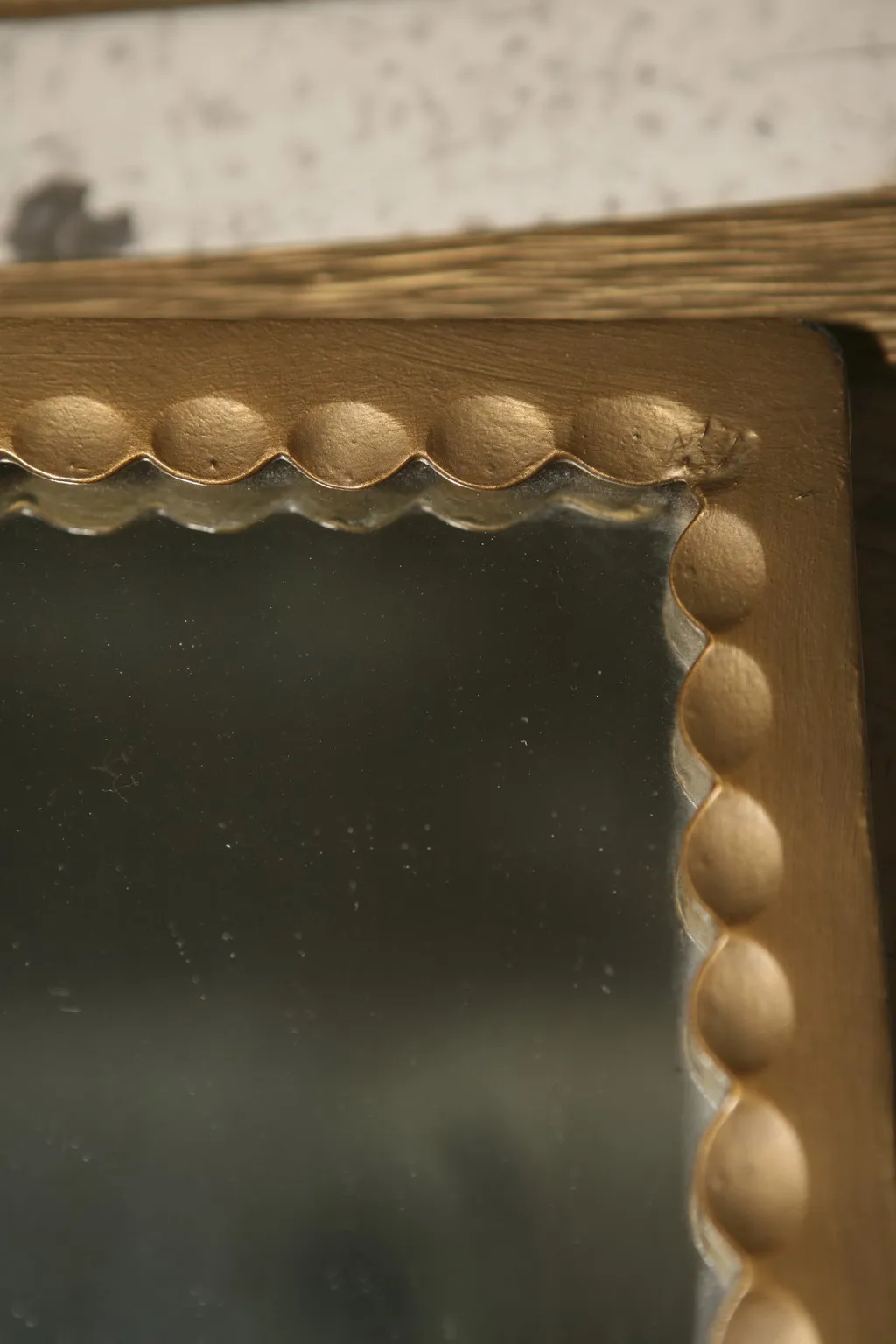antique coat rack with an elegant design and golden frame details