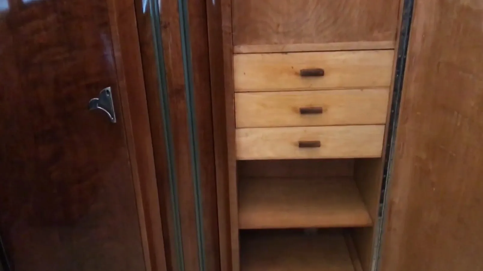 antique wooden bookcase with dark handles and empty shelves, vintage style