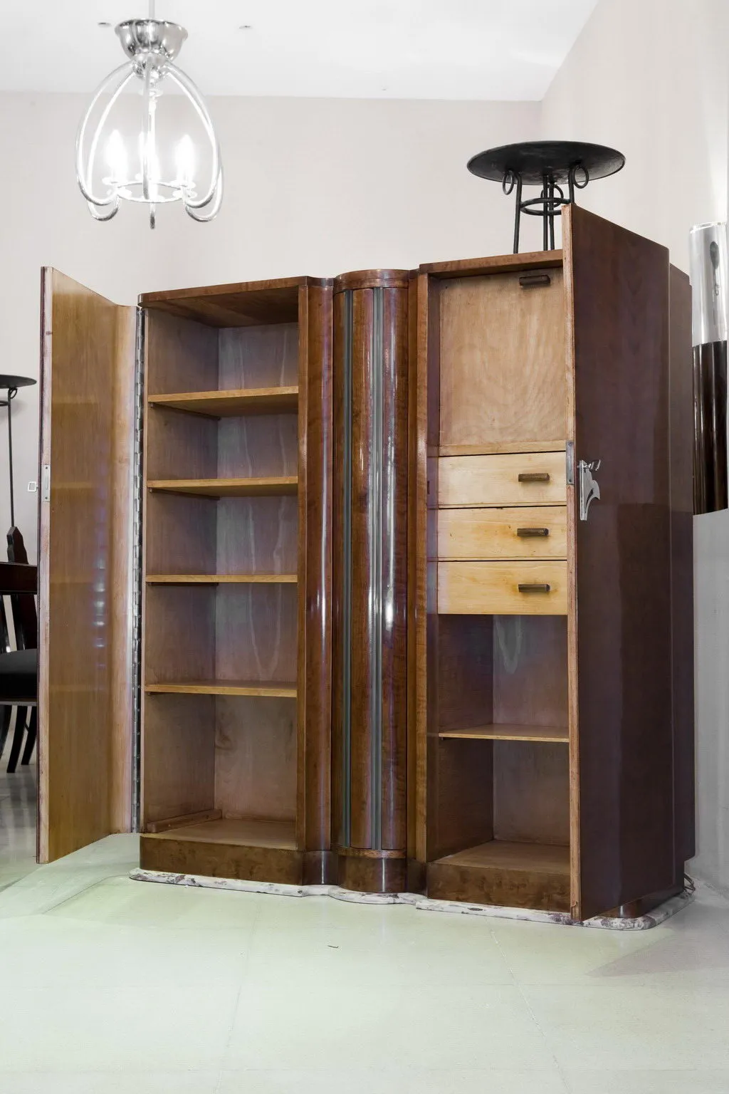 Antique bookcase with shelves and handles, light background.