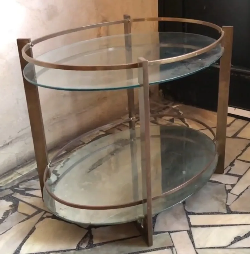 Antique bar cabinet with glass shelves in an elegant setting