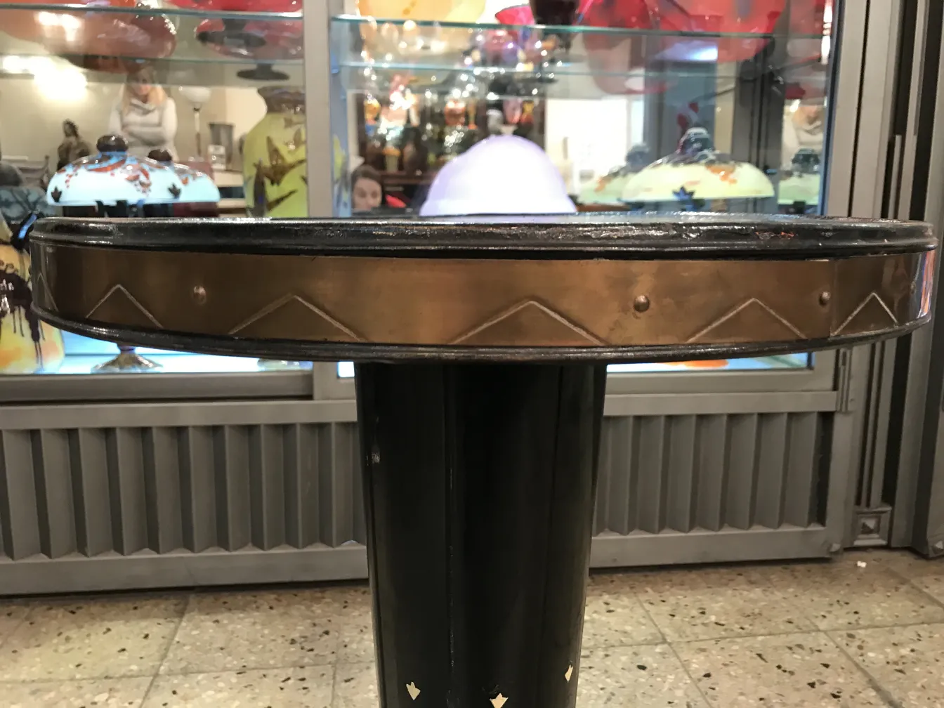 decorative antique small table with circular design, colorful background