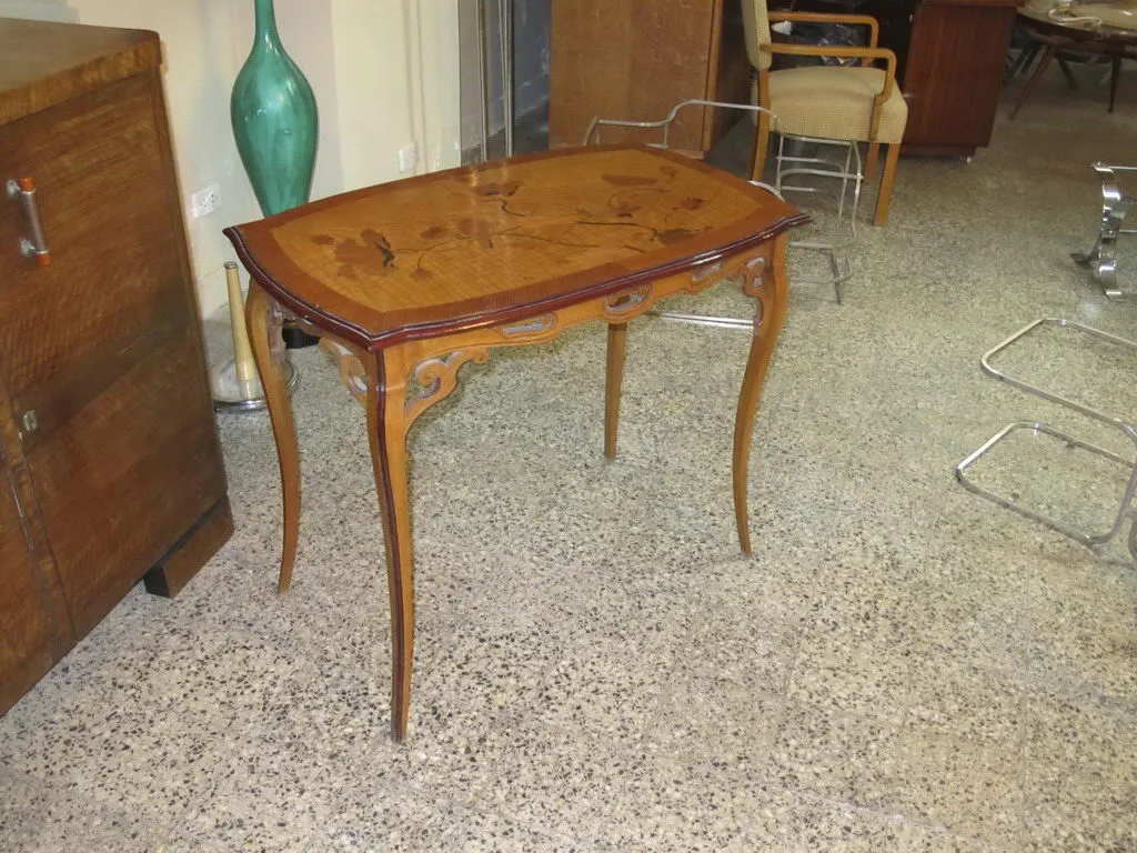 antique table with decorative details by émile gallé, cozy setting