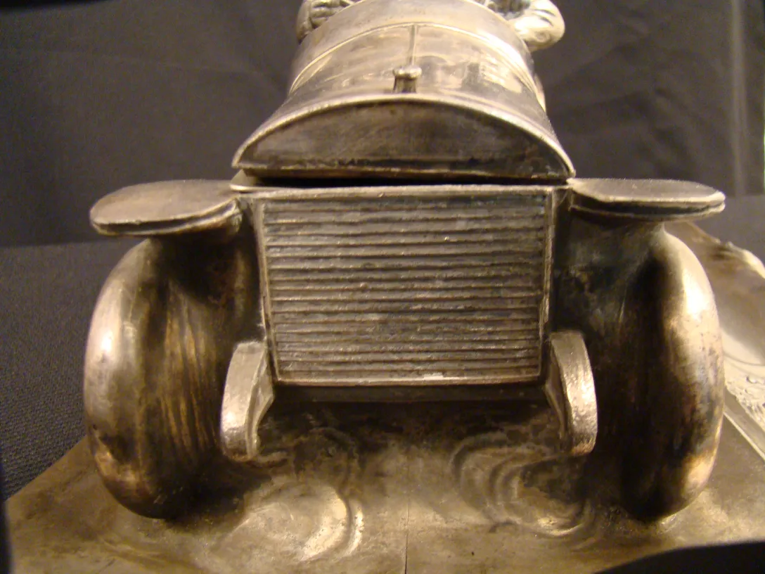 antique inkwell shaped like a vehicle detail