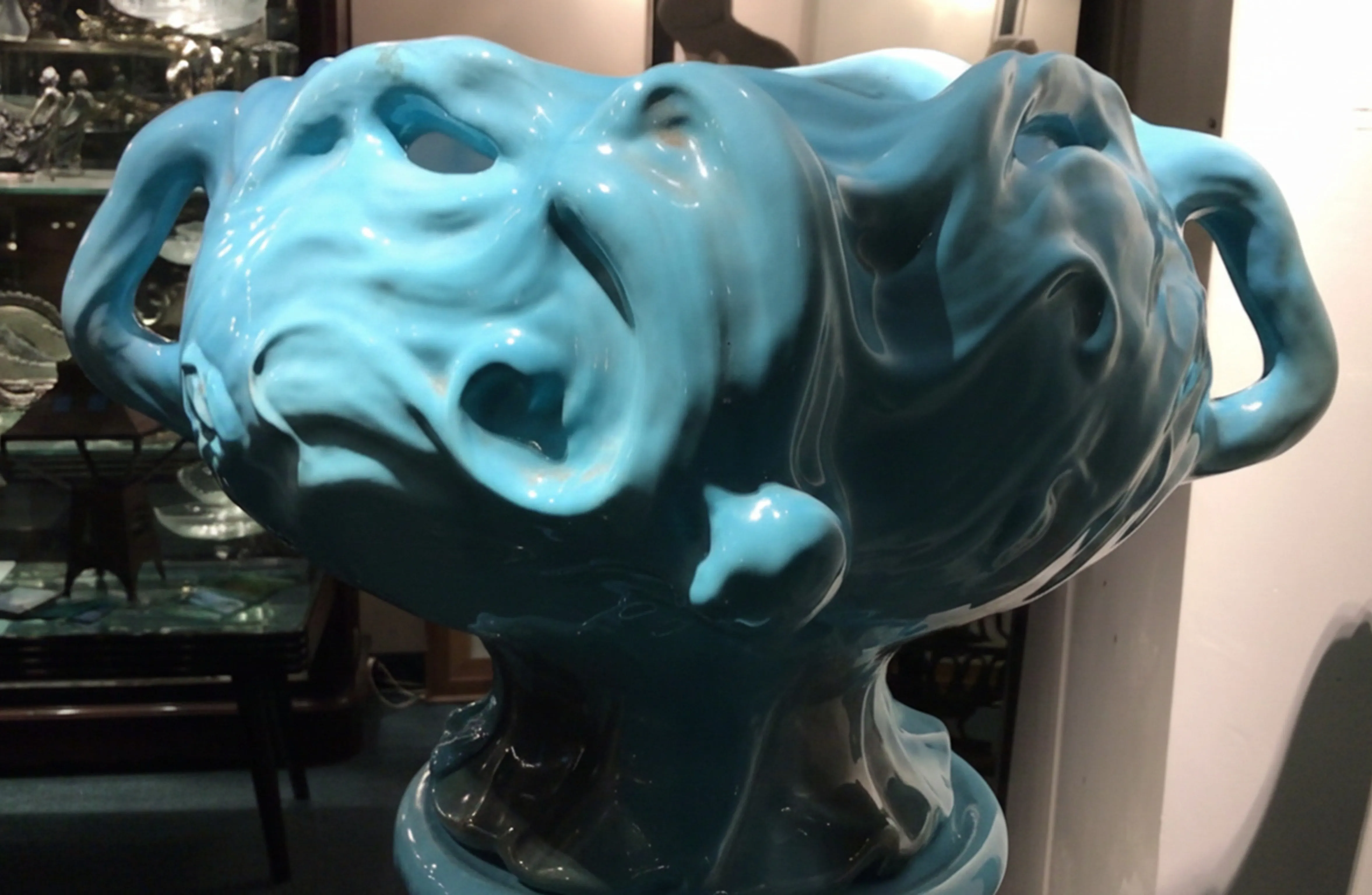 antique vibrant blue planter with artistic shape and two handles