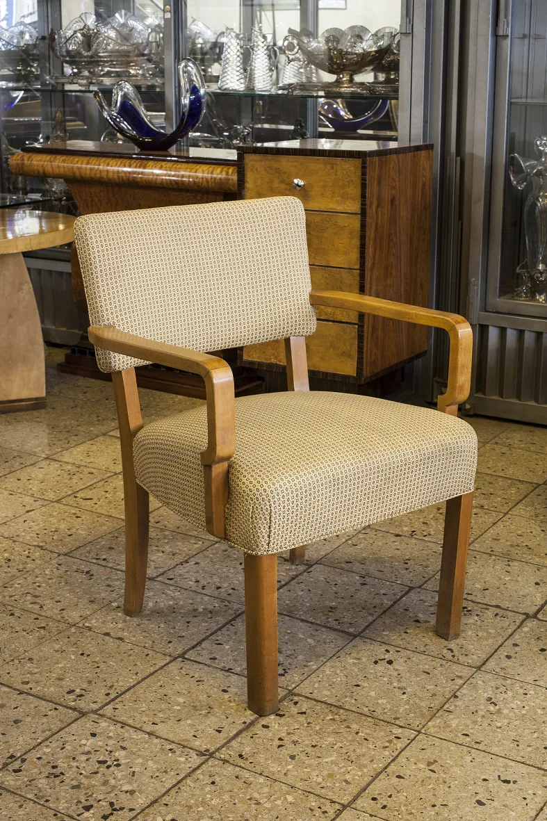 Antique desk chair with classic design in an elegant setting.