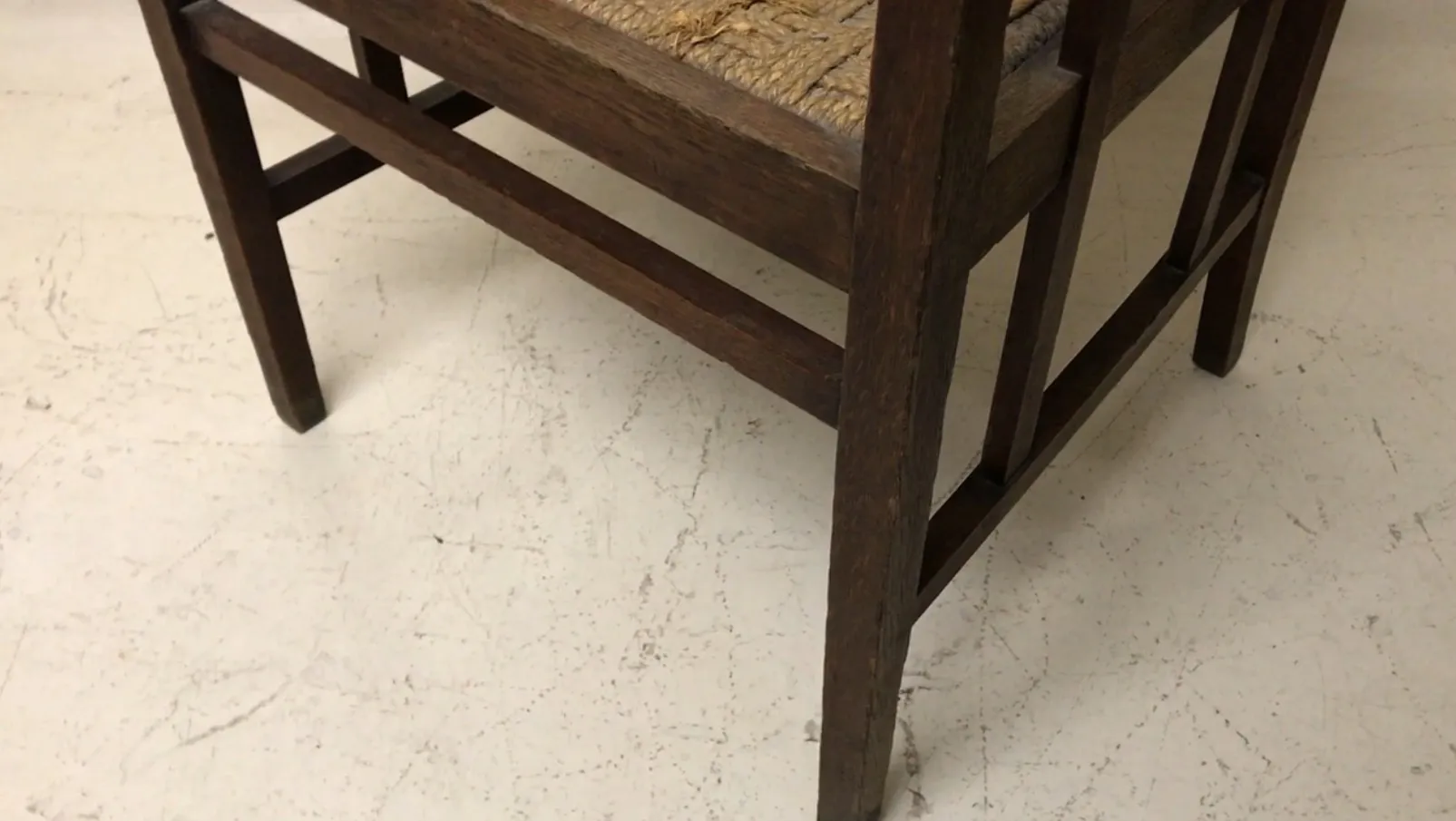 Antique desk chair with straight legs on light background