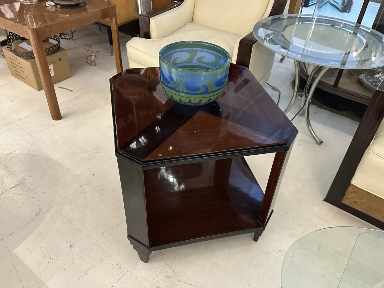 Antique coffee table in Art Deco style, with subtle decorations.