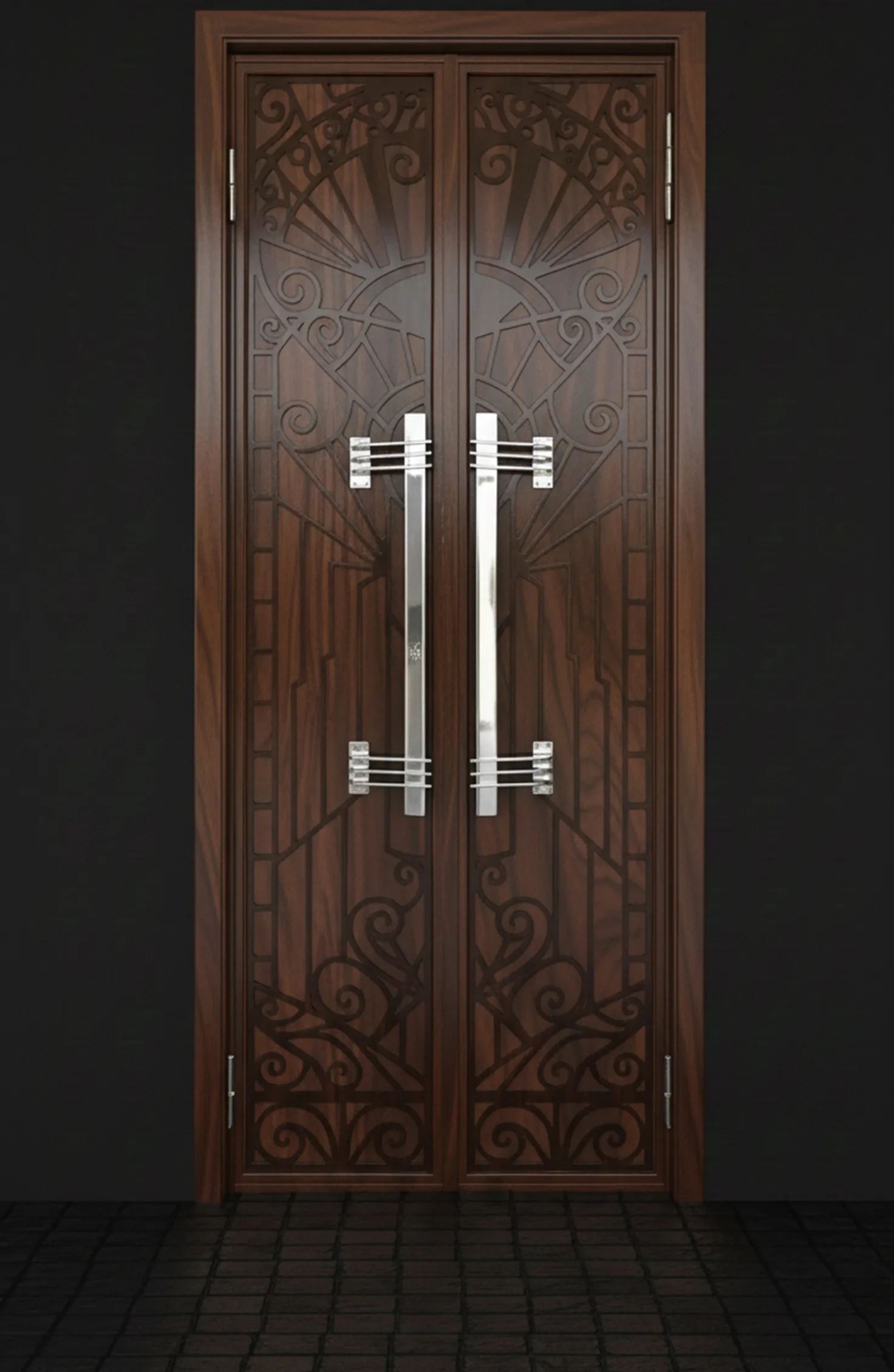 Antique door handles with ornamental design, dark background.