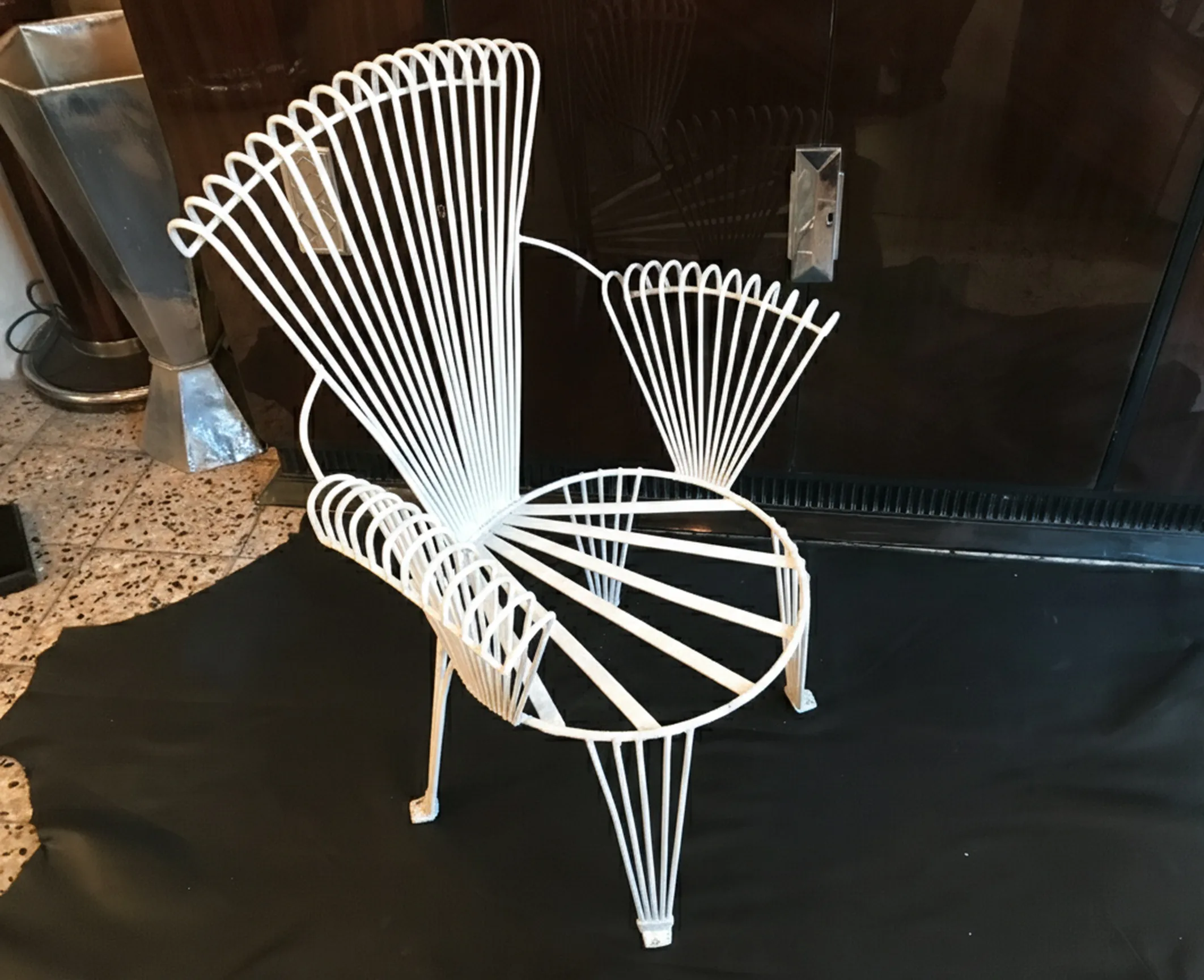 4 antique garden armchairs with a unique design, in a cozy setting.