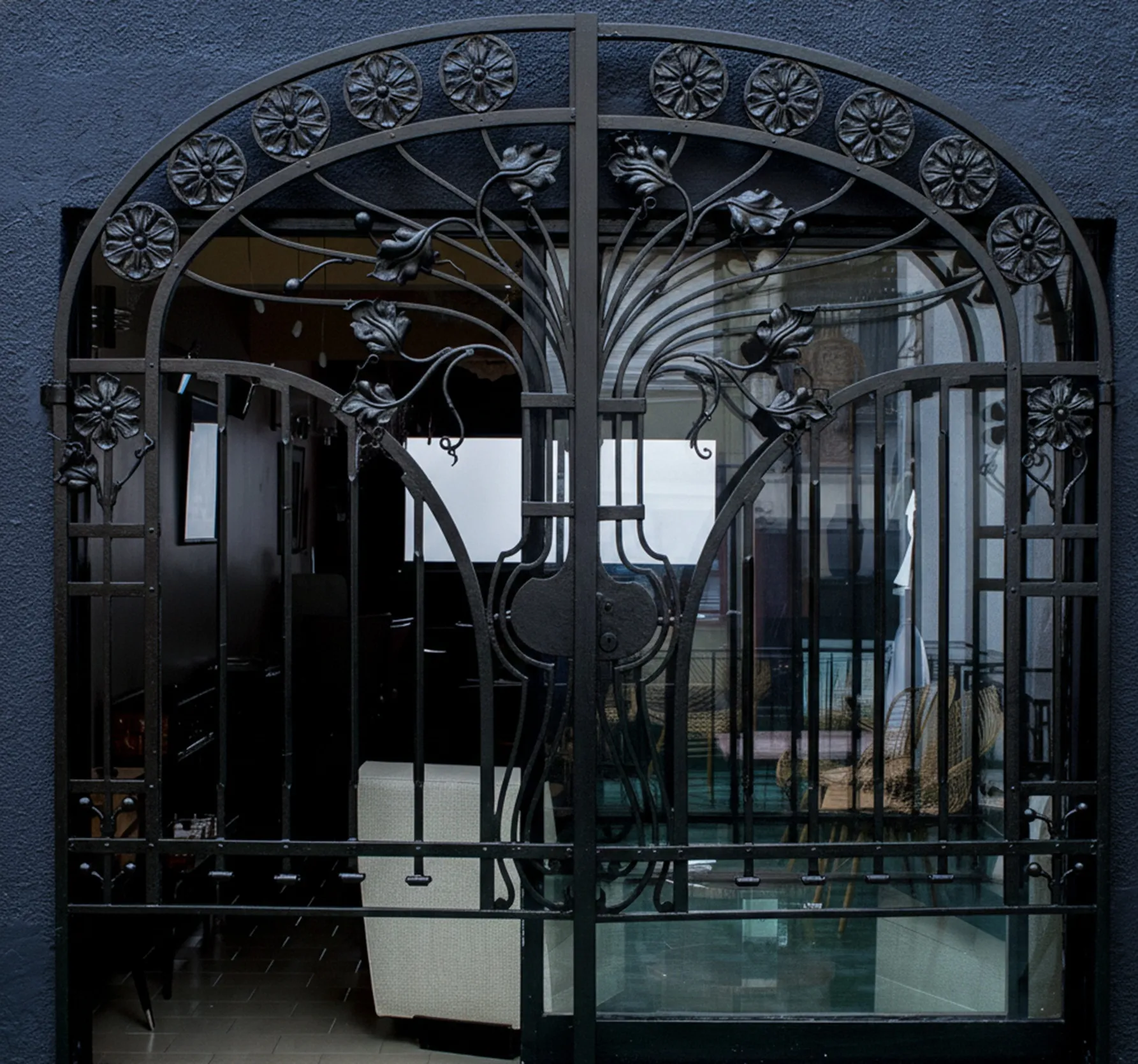 antique gate with elegant floral design, closed