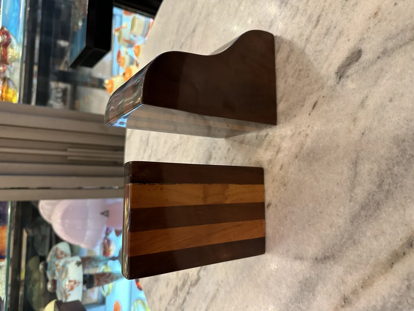 A pair of wooden bookends in an antique setting