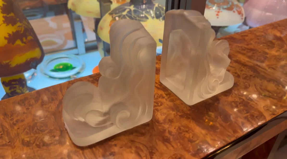 Antique decorative bookends with wavy design.