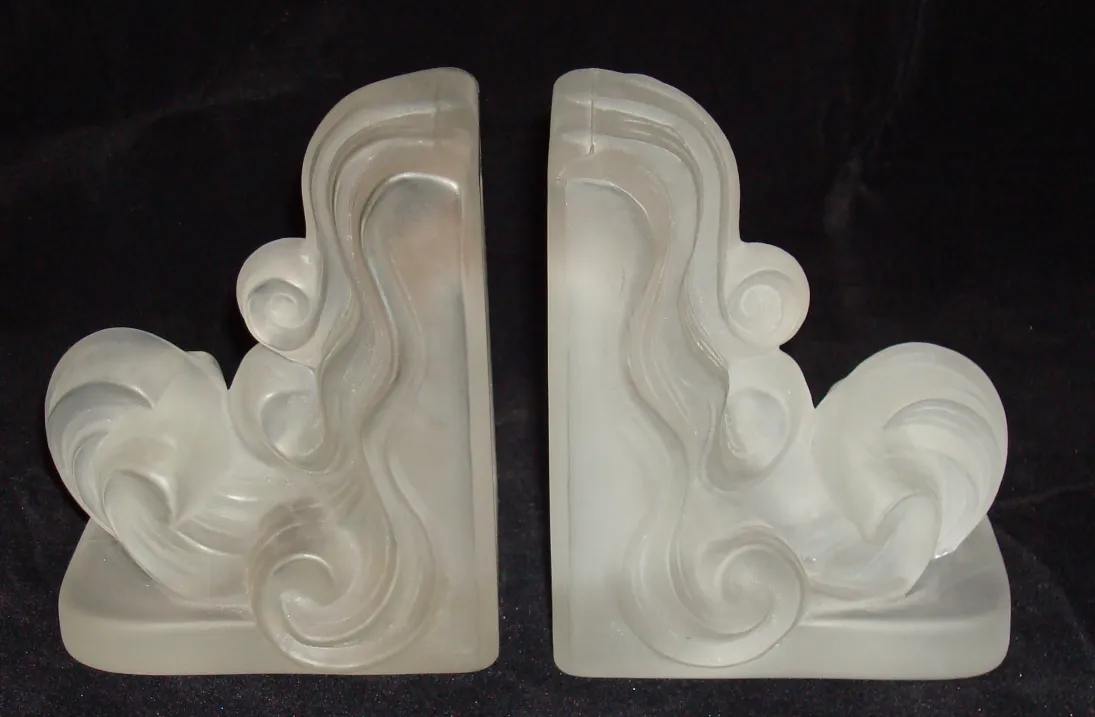 Antique decorative bookends with elegant swirl design.