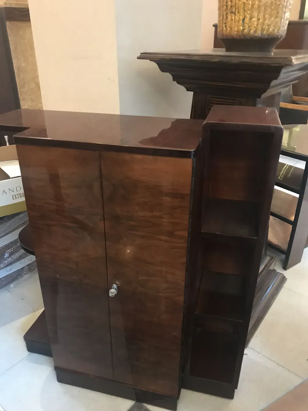 Antique bookcase with cabinets and shelves in a stylish setting.