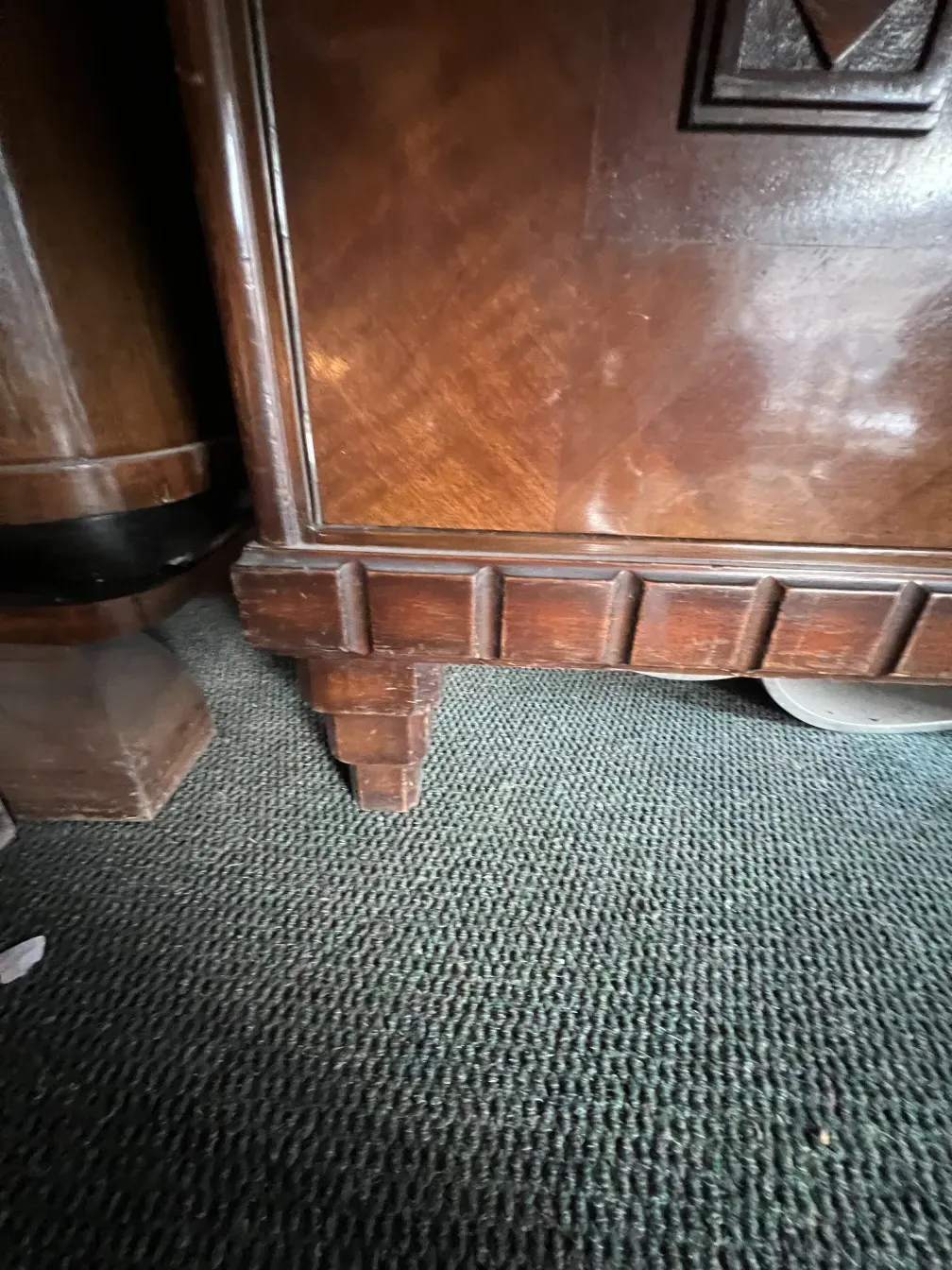 detail of an antique bookcase with unique decoration