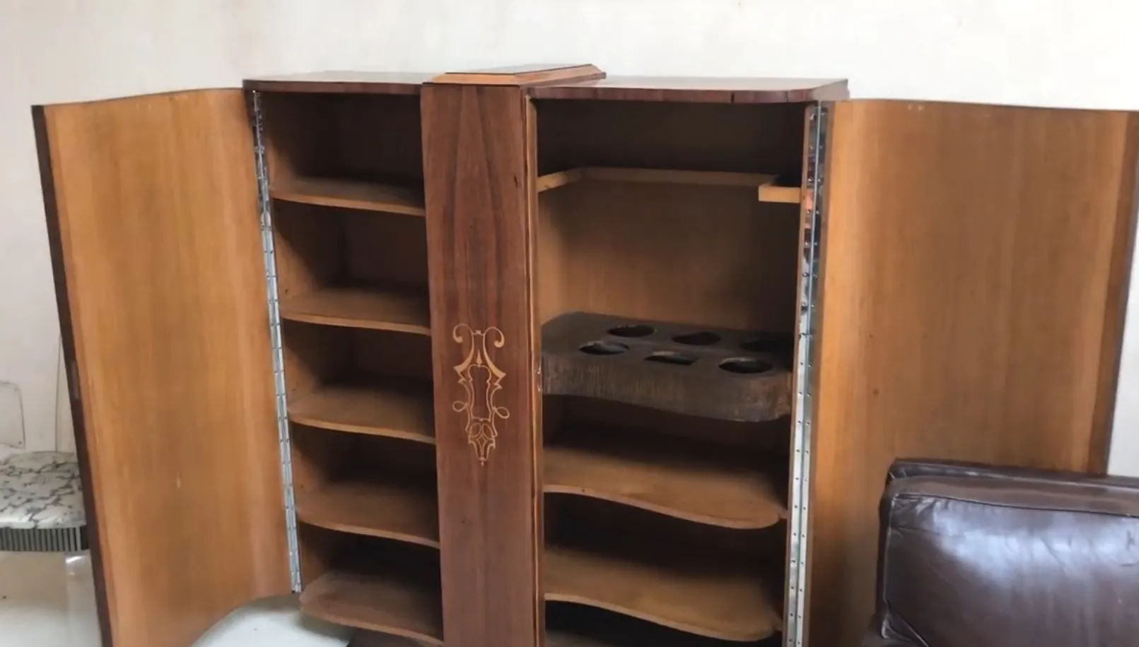 antique bookcase with wooden shelves and elegant design in a cozy setting