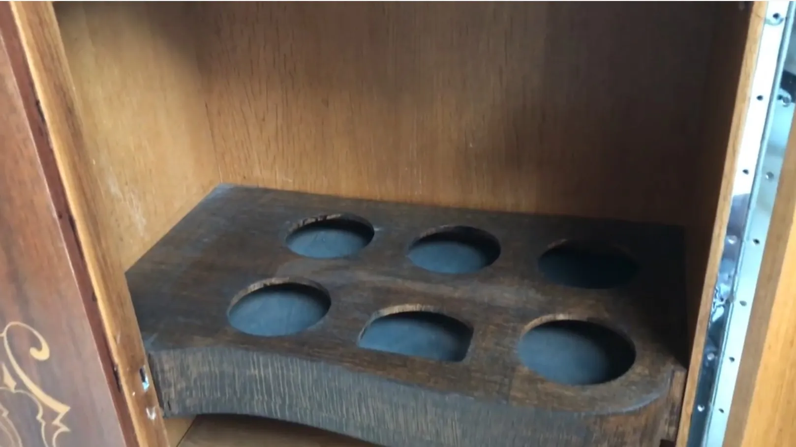 Interior of an antique bookcase with compartments for books, detailed and cozy.