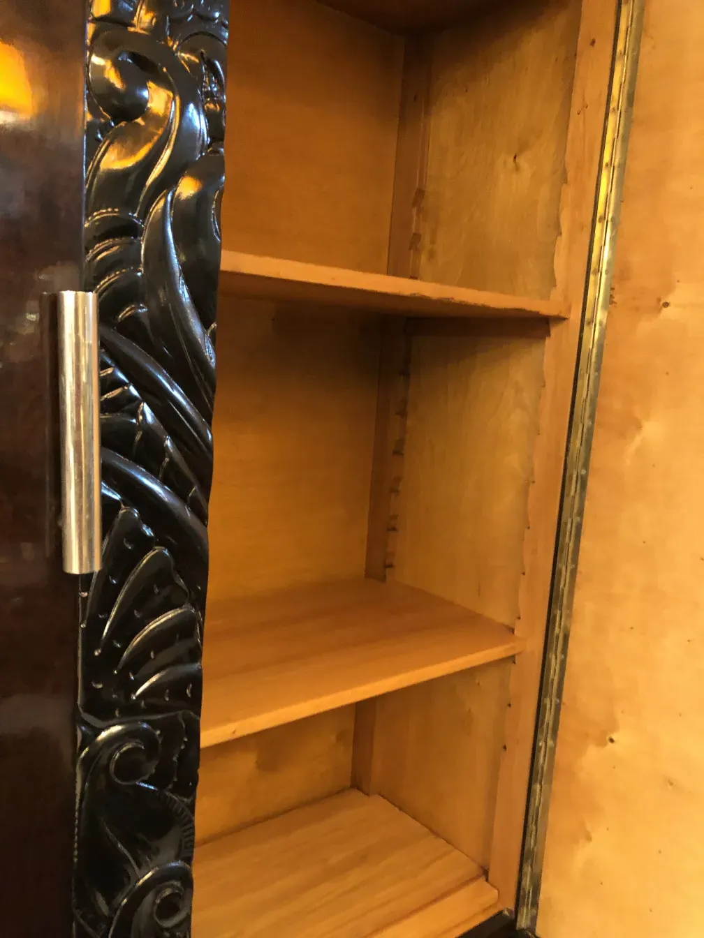 Top view of an antique bookcase with empty compartments and decorative design